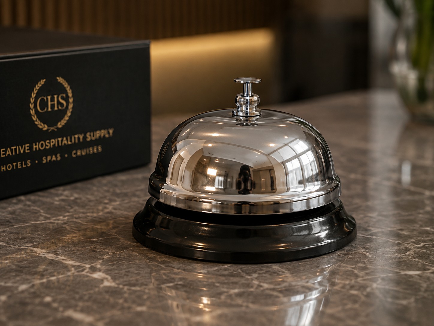 Reception bell in chrome-plated brass on a front desk