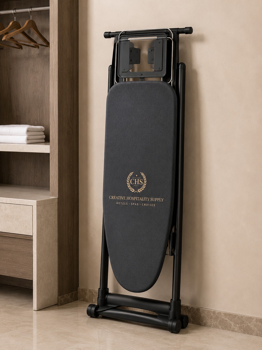 Foldable ironing board with CHS logo in a wardrobe