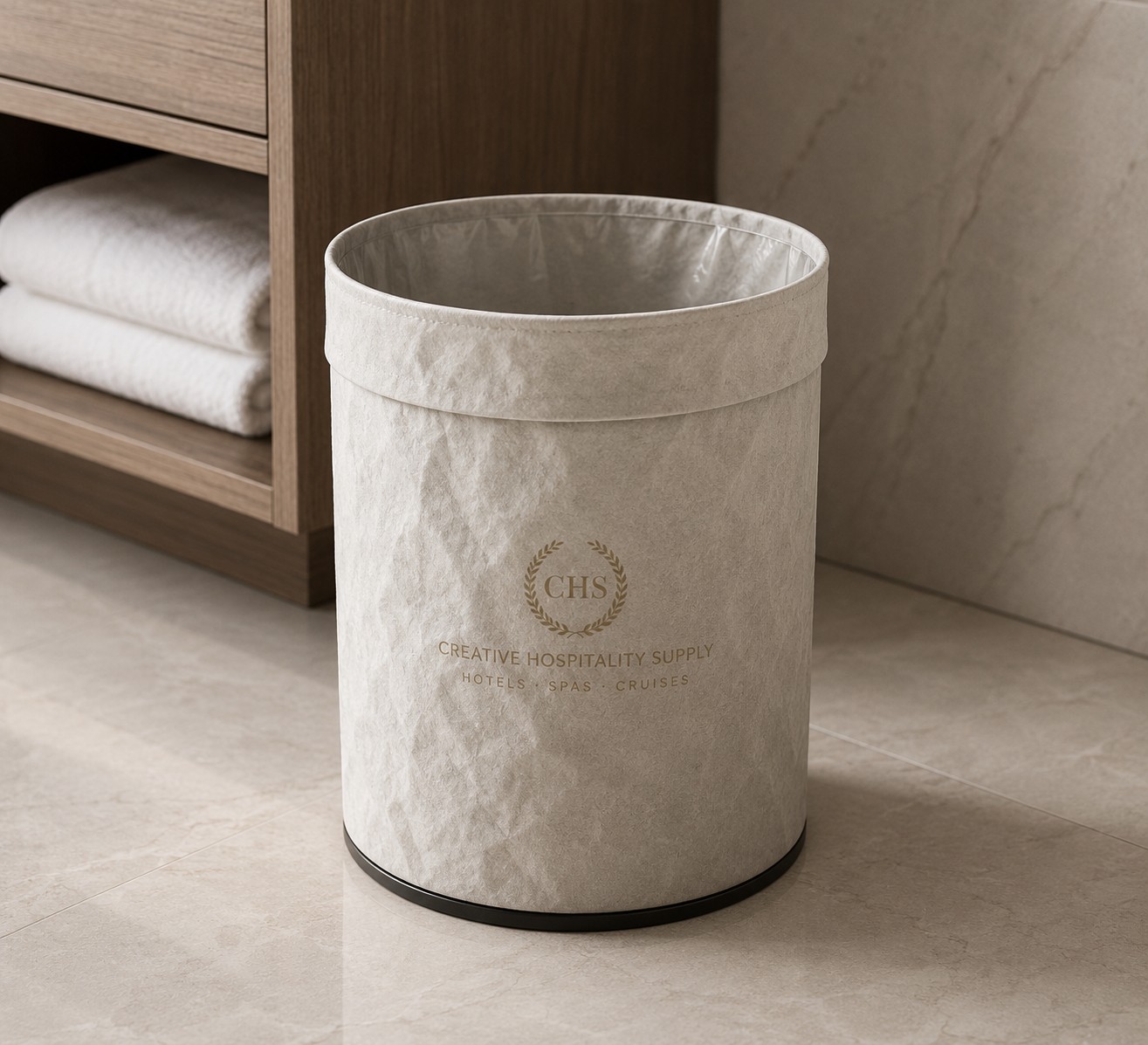 Restroom waste bin in jacron with CHS logo in a bathroom