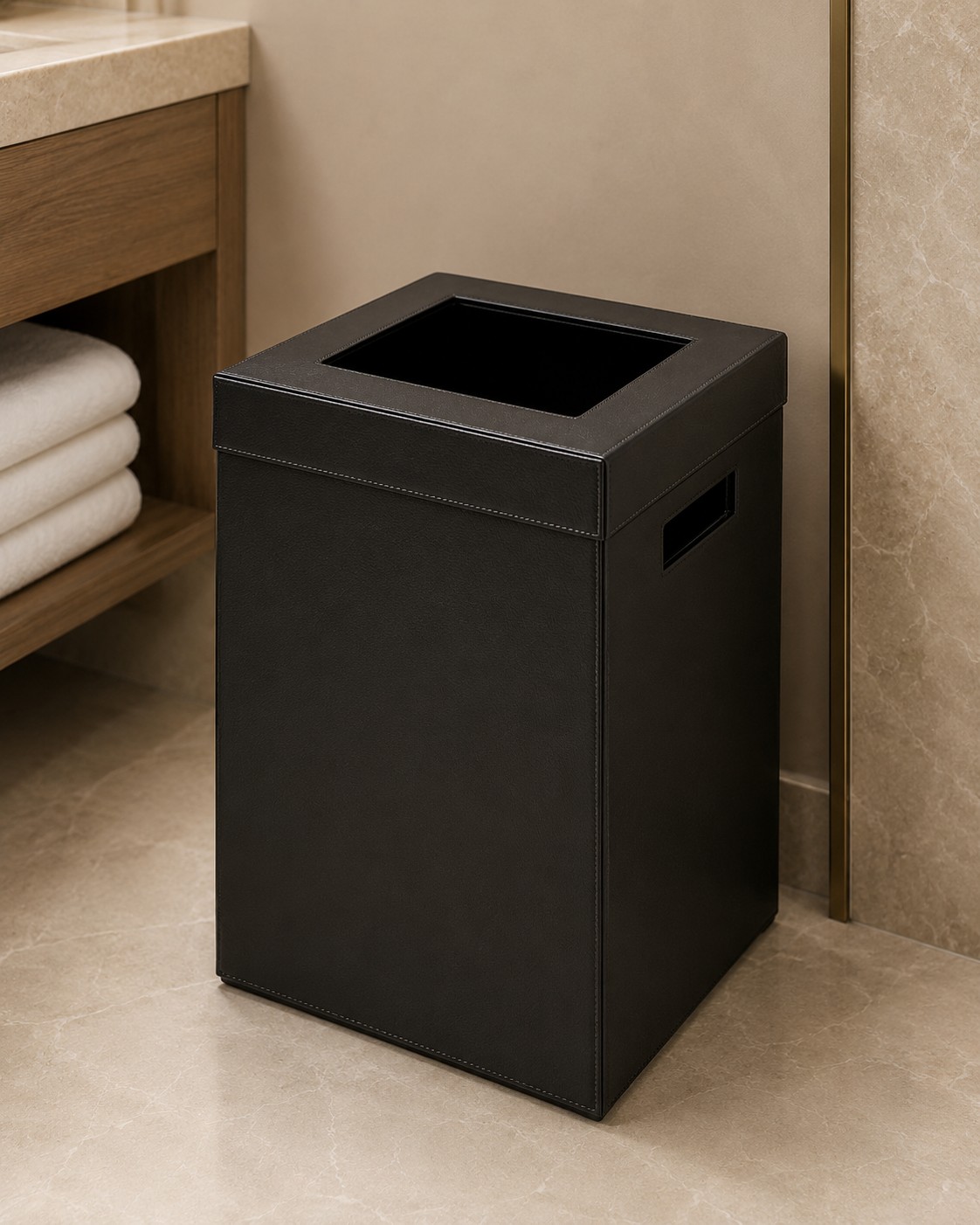 Restroom waste bin in black faux leather in a bathroom