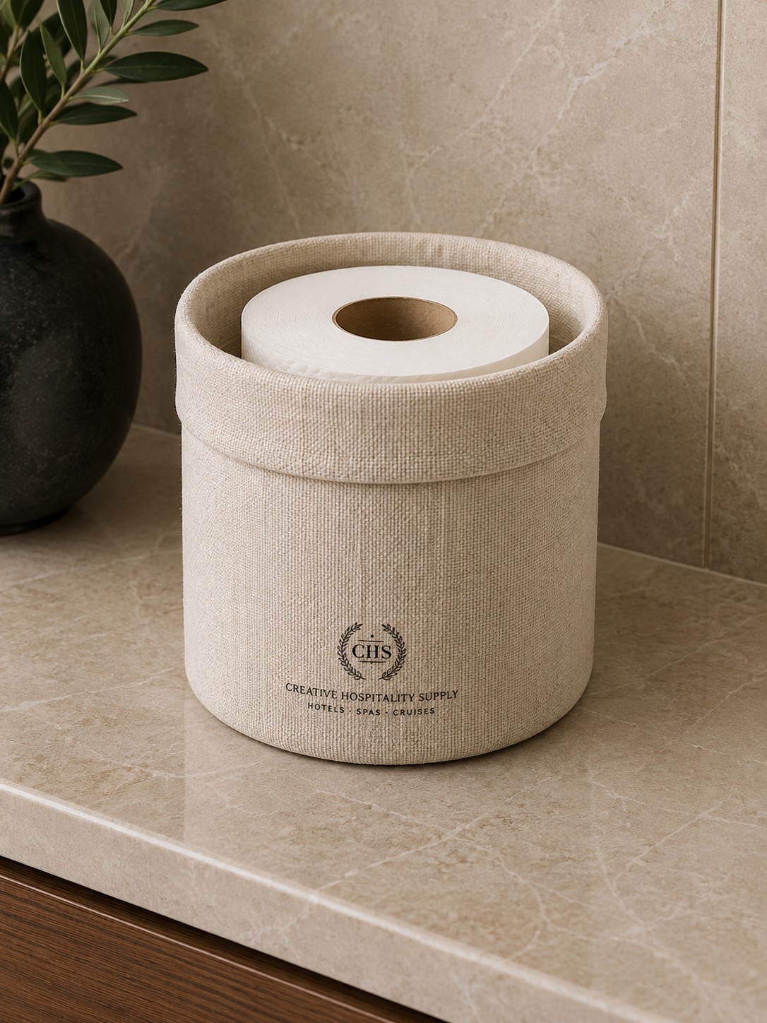 Toilet paper bag with CHS logo, fabric, in a bathroom